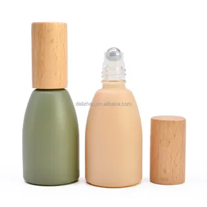 كرة زجاجية ساخنة لزجاجة العطر يمكن نحت غطاء من خشب البامبو لون أخضر ووردي غير لامع