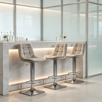 Chaise de bar grise carrée en velours capitonné pivotante réglable en hauteur avec repose-pieds en métal chromé