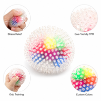 Balle anti-stress TPR personnalisable, jouet sensoriel transparent texturé 6 cm pour la coordination œil-main et l'entraînement de la préhension, OEM