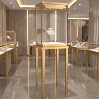 Vitrine à bijoux verticale de luxe en or avec éclairage LED, vitrine moderne en verre trempé pour les magasins de détail