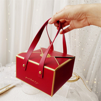 Boîte à gâteaux ondulée pliante de luxe Boîte d'emballage cadeau souvenir de bonbons au chocolat avec poignée en cuir