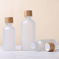 10ml 100ml bouteille en verre d'huile essentielle bouteille en verre opale vide bouteille cosmétique en verre blanc avec bouchon à vis en bambou pour huile de Massage