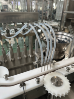 Machine de remplissage et de conditionnement automatique multifonction à 4 têtes pour produits chimiques, liquides et pâtes en tubes et bouteilles, avec moteur et fonction de pesage