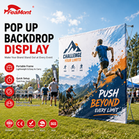 Stand d'exposition pop-up FEAMONT pour événements sportifs et promotion de marques en extérieur, avec structure robuste et graphisme imprimé UV