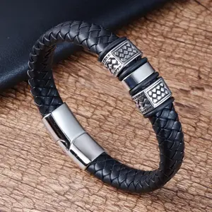 Braccialetto in vera pelle con incisione Logo personalizzato all'ingrosso bracciale in pelle intrecciata con chiusura magnetica da uomo in acciaio inossidabile