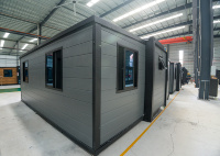 Maison conteneur extensible grise, certifiée CE, résistante aux chocs, préfabriquée pour environnements difficiles