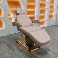 Table de massage électrique de luxe pour spa facial et esthétique, avec base dorée, commande au pied et 3 moteurs, incluant tabouret