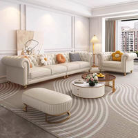 Canapé en cuir véritable de style français, trois places, en forme de L, couleur crème, pieds en bois massif, détails zippés, luxe léger, salon