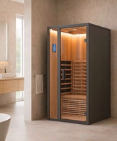 Sauna infrarouge compact avec luminothérapie rouge, porte panoramique en verre et intérieur en bois naturel