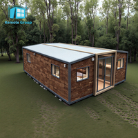 Bureau préfabriqué à faible coût écologique à distance pliable paquet plat 2 chambres à coucher 40ft maison conteneur extensible avec salle de bain cuisine
