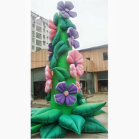 Sculpture de fleur gonflable personnalisée qui fleurit sur la décoration de bâtiment de scène de festival de fleur de mur