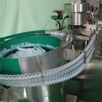 Machine intégrée de remplissage de liquide rotatif de bouchon de bouteille inférieur de disque vibrant entièrement automatique, adaptée à divers produits liquides