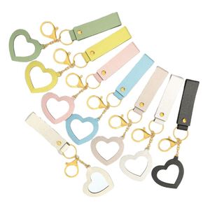 Low MOQ Cute and Creative Small PU <b>Leather</b> Heart-shaped Mirror <b>Keychain</b> with Many Colors for Bag Pendant in Stock - Product Image 5