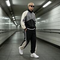 Ensemble de survêtement pour homme en nylon tissé à blocs de couleur, séchage rapide, 2 pièces, style sportif streetwear, fabricant de vêtements OEM ODM avec logo personnalisé