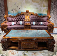 Ensemble de canapés Chesterfield sectionnels traditionnels européens en bois massif, revêtement en cuir capitonné, pieds sculptés en forme d'éléphant, appartement, hôtel