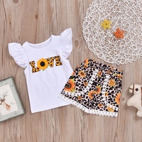 Ensemble de vêtements pour enfants en bas âge très vendu, t-shirt à manches courtes à volants imprimé, short à franges, deux pièces, vêtements d'été pour filles