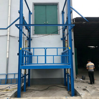 Plateforme élévatrice verticale hydraulique sur rail de guidage, élévateur de marchandises stationnaire, monte-charge électrique pour le stockage et le regroupement de marchandises en entrepôt