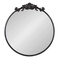 Nouveau miroir mural en verre et bois de style baroque antique doré, avec décoration ornée, de la marque SWT Anthropologie.