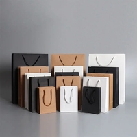 Sacs en papier kraft blanc avec logo personnalisé de luxe boutique de cosmétiques bijoux cadeau shopping avec poignée en ruban pour l'emballage des vêtements