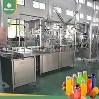Machine de remplissage automatique haute précision à 4 têtes pour jus de miel, d'orange et de mangue en bouteilles PET