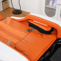Lit de massage de luxe de type cabine avec oreiller cervical et commande tactile pour salon de beauté et spa capillaire