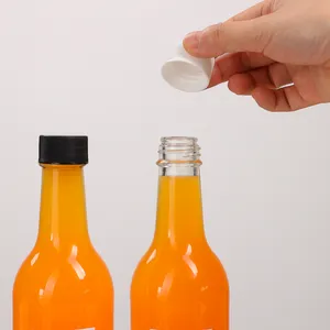 350ml 12 once trasparente tonda salsa piccante tonda imballaggio bottiglia di vetro stordita con riduttore di orifizio e tappi a vite in plastica da 24 415