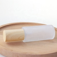 Bouteille ronde en verre dépoli 30 ml 50 ml 100 ml 120 ml bouteille en verre et pot en verre avec couvercle en bois couvercle en plastique pour les cosmétiques