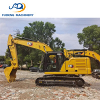 Excavatrice sur chenilles CAT 320GC d'occasion bien entretenue, 20 tonnes, avec godet de 1,1 m³ pour les travaux de pose de canalisations en construction urbaine