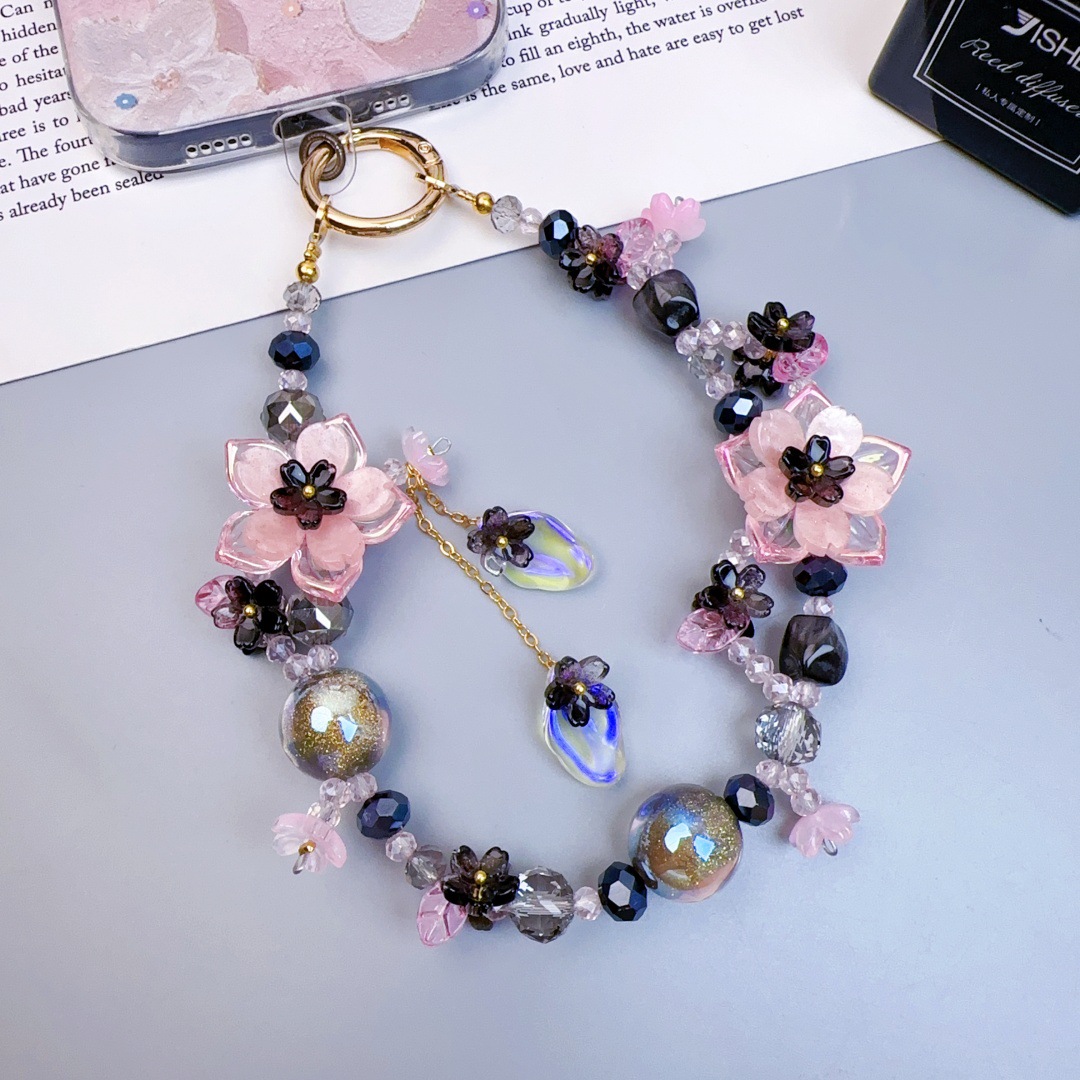 Cadena para móvil negra y rosa.