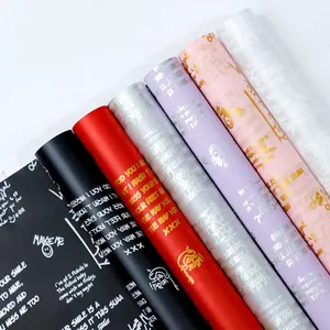 印刷英文塑料防水玫瑰花束薄纸卷韩版包装用鲜花包装纸