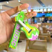 Porte-clés mini guitare premium avec breloque instrument de dessin animé et dragonne imprimée pour cadeaux souvenirs musicaux