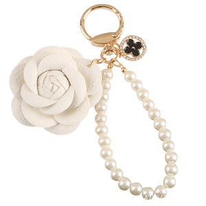 พวงกุญแจโลหะรูปไข่มุกใหม่ น่ารัก ประดับเพชร พวงกุญแจดอกไม้เล็กๆ ของตกแต่งกระเป๋าใส่หูฟัง - Product Image 5