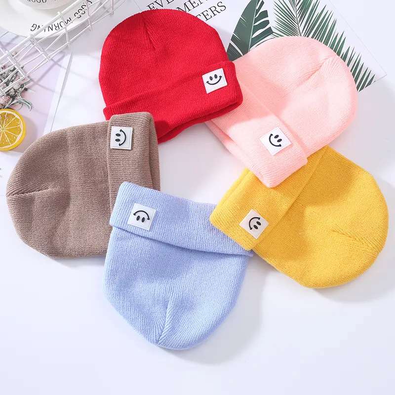 Commercio all'ingrosso in magazzino di alta qualità per bambini unisex invernali caldi berretto colorato ricamo personalizzato con disegno sorriso cappello berretto per bambini