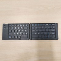 Nouveau mini clavier portable sans fil rechargeable à double pliage pour tablettes iPad et ordinateurs portables