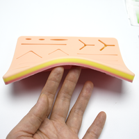 Kit d'entraînement à la suture populaire en gros, coussin de suture en silicone réaliste pour mannequin, formation des étudiants en médecine, qualité supérieure, noir