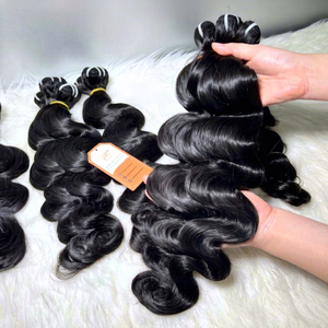 Vendeur de cheveux en gros Extensions de cheveux ondulés pour le corps 100% Paquets de cheveux vietnamiens bruts Prix bon marché Longue durée - Product Image 1
