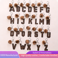 Porte-clés en cuir PU de haute qualité avec breloques alphabet imprimées en typographie tendance pour sacs à main féminins