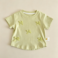 T-shirt OEM personnalisé pour filles, à manches courtes, orné d'un nœud, en tissu fin, col rond, pour l'été, le printemps, l'école, le quotidien et les sorties