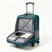 Sac à dos à roulettes Teal Softside avec bretelles rembourrées, poche avant zippée, poche latérale en maille, roues pivotantes