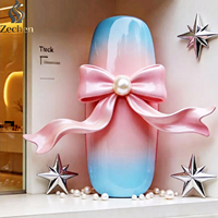 Modèle de sculpture géante pour nail art, décoré de nœuds et de perles, parfait pour les salons de manucure et instituts de beauté comme décoration murale