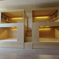 Lit superposé moderne multi-niveaux en forme de capsule, idéal pour les appartements étudiants, les hôtels-capsules et les auberges de jeunesse.