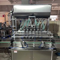 Machine de remplissage automatique de liquides industrielle de haute précision pour le miel, le shampoing, l'huile, les contenants en verre, système de pesage rotatif pour mise en conserve