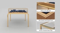 Comptoir à bijoux en acier inoxydable durable, vitrine haut de gamme en métal et verre avec éclairage LED pour mobilier de showroom de vente au détail