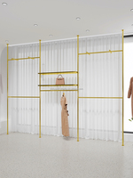 Présentoir pour vêtements de la boutique personnalisée Présentoir mural pour vêtements pour magasins de vêtements Présentoir pour vêtements doré pour magasin de vêtements