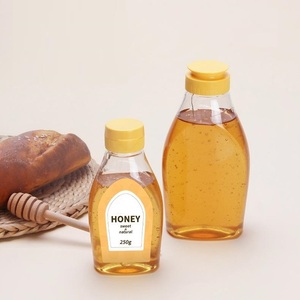 Botellas de Plástico PET Transparentes de Grado Alimenticio de 250g y 500g con Tapa Abatible y Válvula de Silicona <span class=keywords><strong>para</strong></span> Miel, <span class=keywords><strong>Salsas</strong></span>, Jarabes y Aderezos - Product Image 1