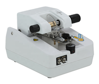 Machine de découpe et de rainurage de lentilles pour le traitement du verre des instruments optiques