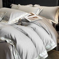 Parure de lit quatre pièces personnalisable en coton à fibres longues 100 fils, couleur unie, avec housse de couette et couvre-lit jacquard