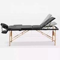 Lit de massage en bois portable confortable en gros d'usine Design moderne en cuir PVC avec lit en bois pliable en métal