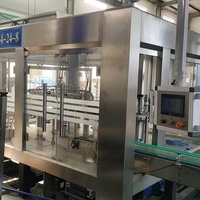 Machine de remplissage automatique de bouteilles en verre pour boissons, eau, jus, thé, miel, sirop, huile de cuisson, ligne de production de remplissage à chaud et de bouchage