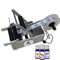 Machine d'étiquetage semi-automatique MT-50 pour bouteilles rondes, idéale pour l'étiquetage des autocollants.